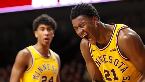 Feb 3, 2024; Minneapolis, Minnesota, USA; Minnesota Golden Gophers forward Pharrel Payne (21) celebrates after blocking a shot against Northwestern Wildcats center Matthew Nicholson (34) during the second half at Williams Arena.